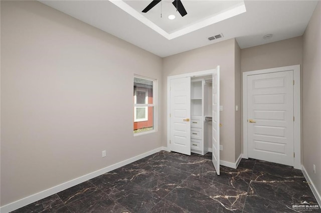 9510 N 71st Ln, Mcallen, TX 78573 - unfurnished bedroom with dark marble finish flooring, recessed lighting, a ceiling fan, and a tray ceiling