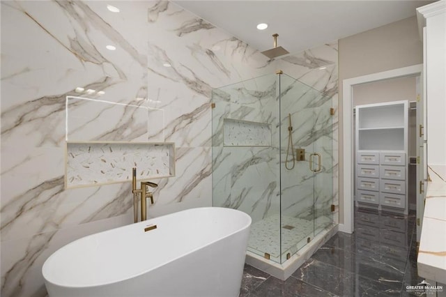 9510 N 71st Ln, Mcallen, TX 78573 - full bath featuring marble tiled floors, a marble finish shower, a freestanding bath, a walk in closet, and recessed lighting