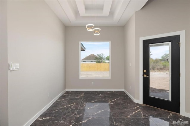 9510 N 71st Ln, Mcallen, TX 78573 - entryway with plenty of natural light, a chandelier, marble finish flooring, and a raised ceiling