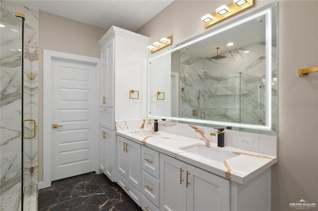 9510 N 71st Ln, Mcallen, TX 78573 - bathroom with marble look tile flooring, a marble finish shower, and double vanity