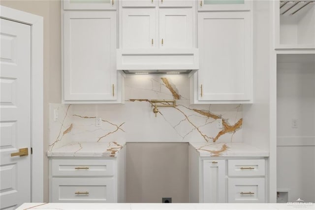 9510 N 71st Ln, Mcallen, TX 78573 - kitchen with backsplash, white cabinetry, and light stone countertops