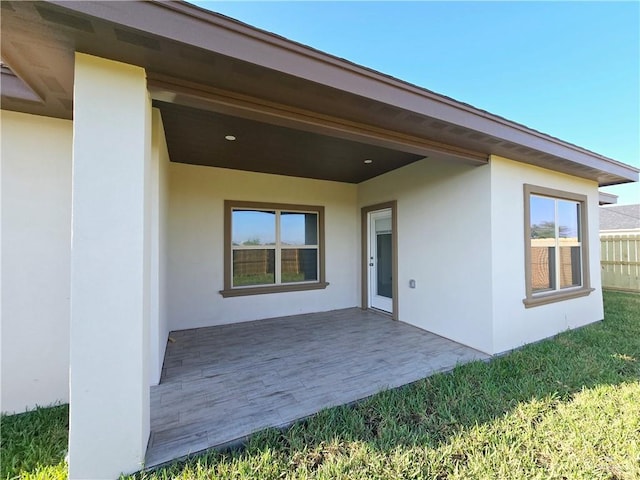 entrance to property with a patio area