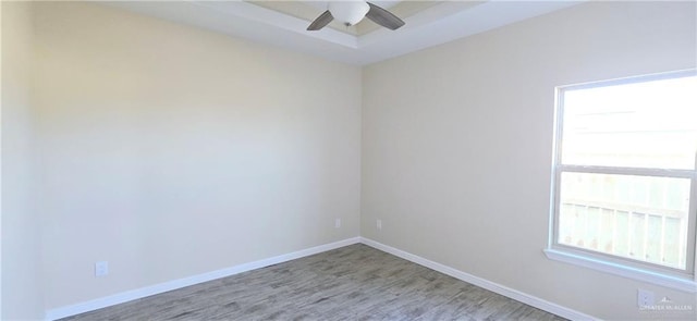 spare room featuring ceiling fan and light hardwood / wood-style floors