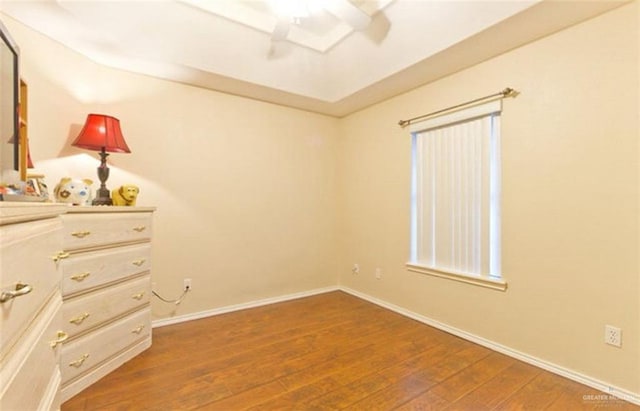 unfurnished bedroom with dark wood-type flooring and ceiling fan