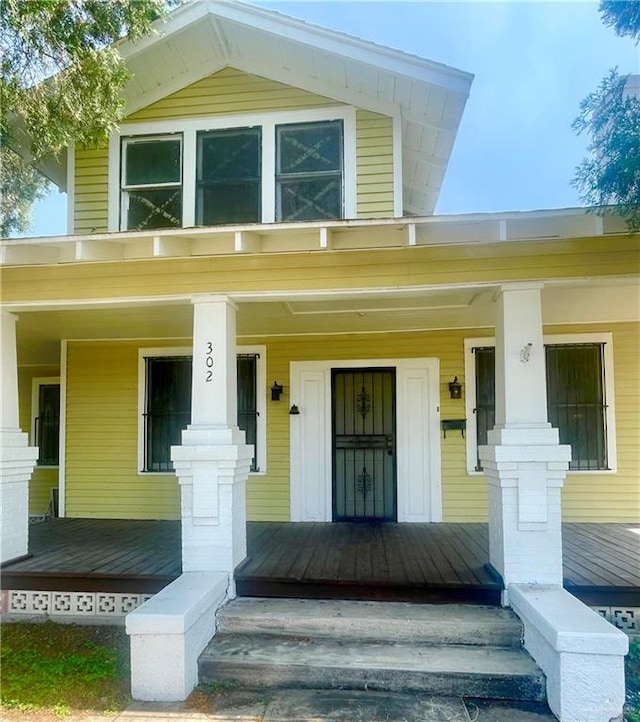 doorway to property with a porch