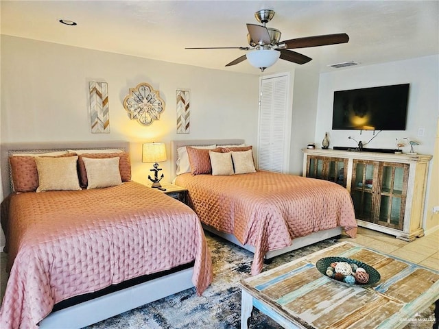 123 Windward Dr, Port Isabel, TX 78578 - tiled bedroom featuring ceiling fan