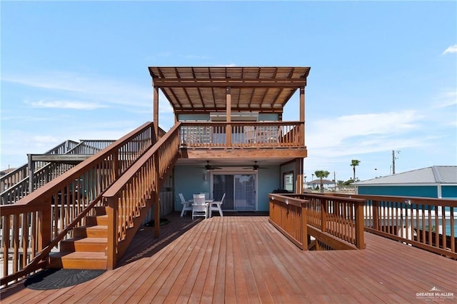 123 Windward Dr, Port Isabel, TX 78578 - wooden terrace featuring a ceiling fan and stairway