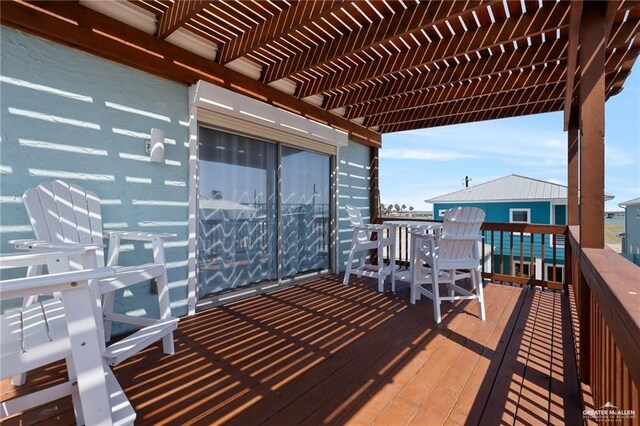 123 Windward Dr, Port Isabel, TX 78578 - wooden terrace featuring a pergola