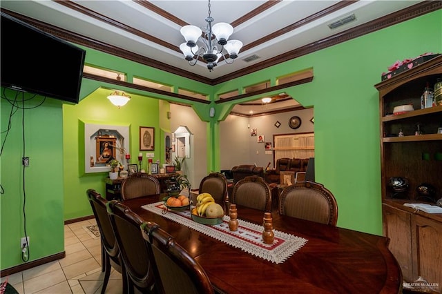 dining room featuring a chandelier, light tile patterned floors, and ornamental molding