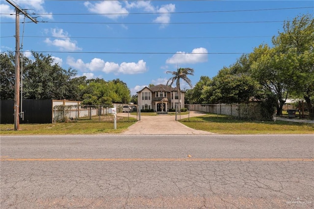 613 E Moore Rd, San Juan, TX 78589 - view of colonial inspired home