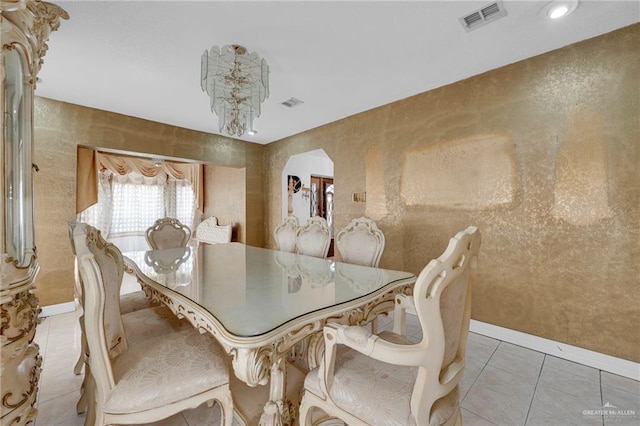 613 E Moore Rd, San Juan, TX 78589 - dining area featuring light tile patterned floors, baseboards, and a chandelier