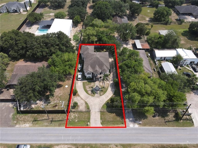 613 E Moore Rd, San Juan, TX 78589 - aerial perspective of suburban area with property parcel outlined
