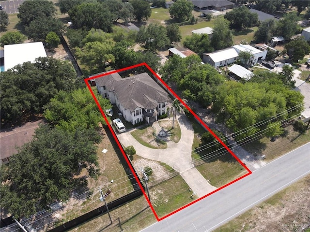 613 E Moore Rd, San Juan, TX 78589 - aerial perspective of suburban area with property parcel outlined