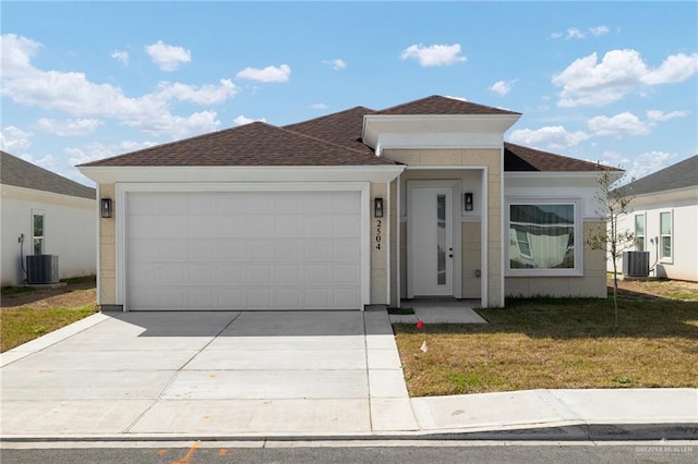 view of front of property with cooling unit, a garage, and a front lawn