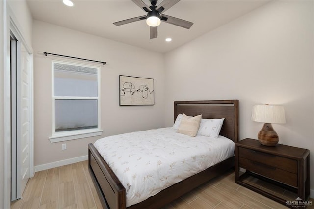 bedroom with ceiling fan and light wood-type flooring