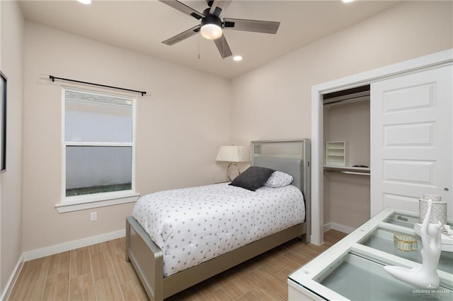 bedroom with ceiling fan and a closet