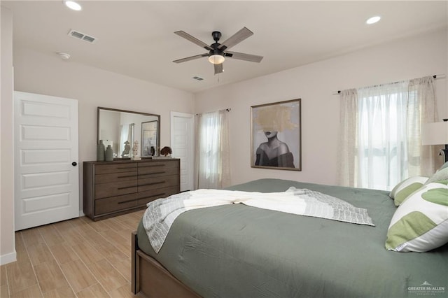 bedroom featuring light hardwood / wood-style floors and ceiling fan