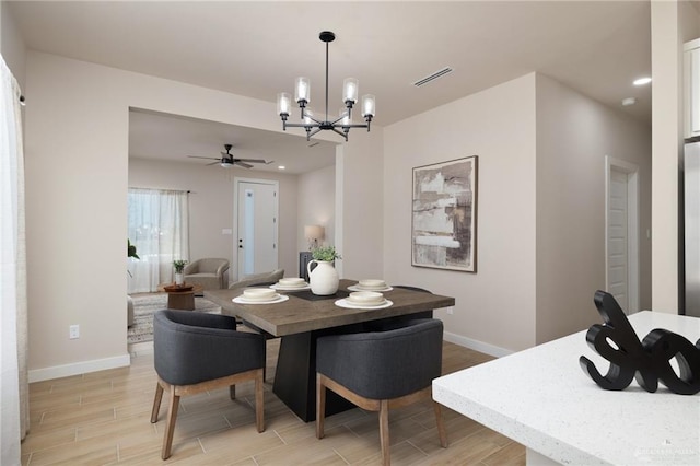 dining space with a notable chandelier