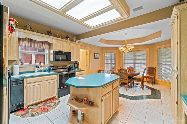 kitchen with black appliances, light brown cabinets, a notable chandelier, a kitchen island, and light tile patterned flooring