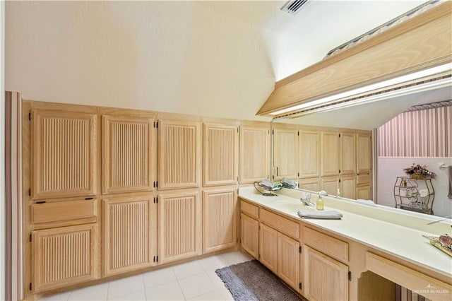 bathroom featuring tile patterned flooring and vanity