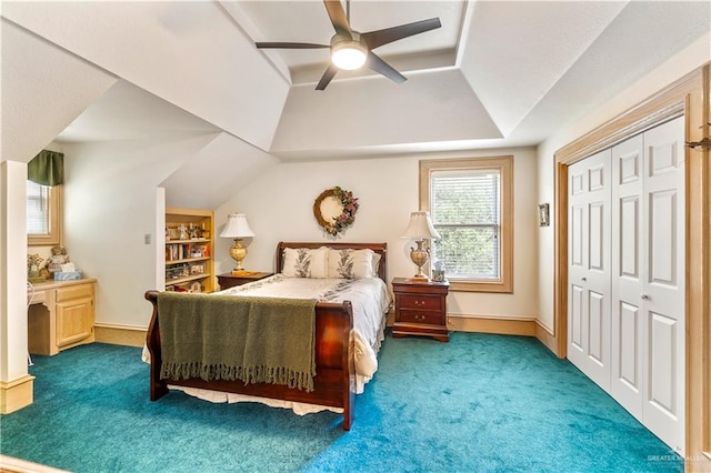 carpeted bedroom with ceiling fan and a closet