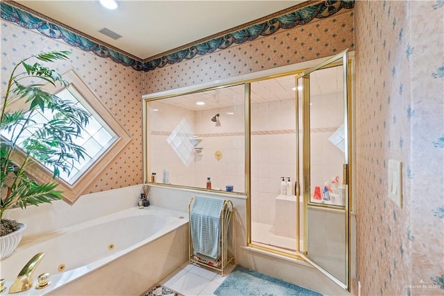 bathroom with plus walk in shower and tile patterned flooring