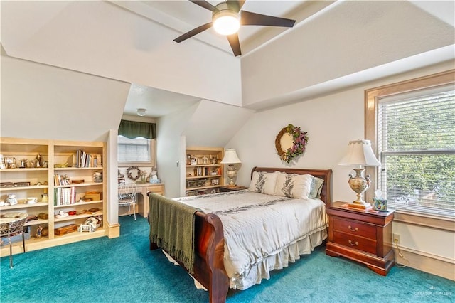 carpeted bedroom with ceiling fan and vaulted ceiling