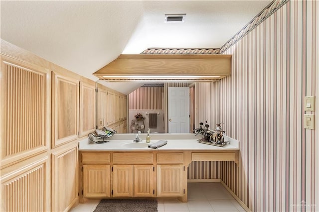 bathroom with vanity and tile patterned floors