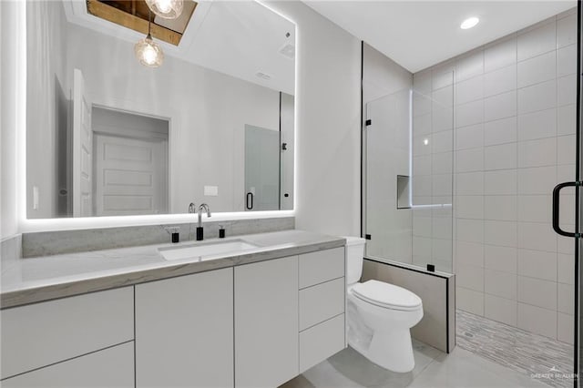 3005 N Alyna Ave, Edinburg, TX 78541 - full bathroom with tiled shower, toilet, vanity, and tile patterned floors