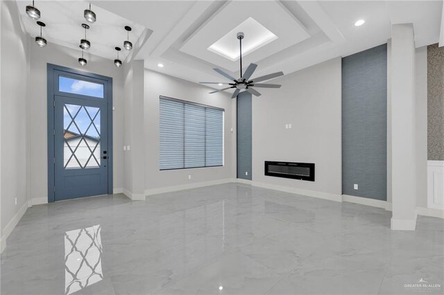 3005 N Alyna Ave, Edinburg, TX 78541 - entrance foyer with light marble finish floors, a ceiling fan, recessed lighting, a glass covered fireplace, and baseboards
