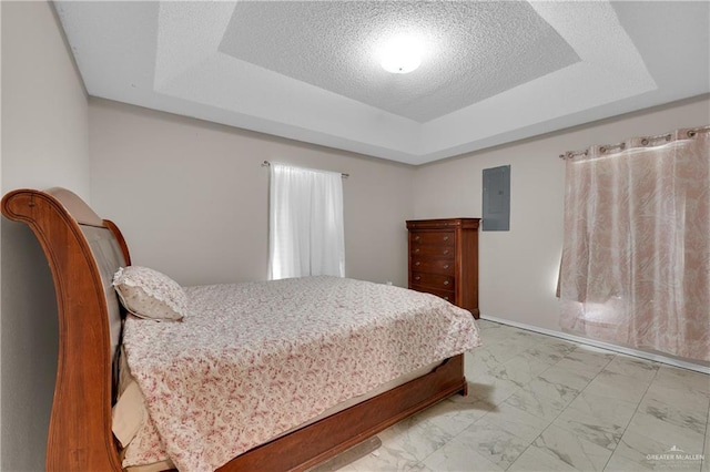 bedroom with electric panel, a raised ceiling, and a textured ceiling