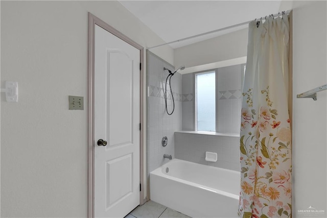 bathroom featuring tile patterned floors and shower / bath combo with shower curtain