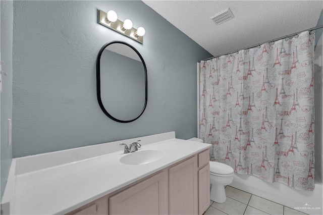 full bathroom featuring tile patterned flooring, vanity, shower / bath combination with curtain, a textured ceiling, and toilet