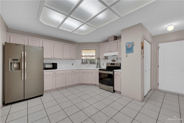 kitchen featuring white cabinetry, stainless steel appliances, sink, and light tile patterned floors