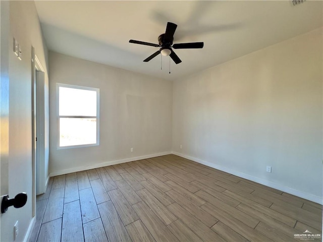 unfurnished room with ceiling fan and light wood-type flooring