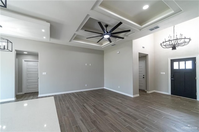 entryway featuring a chandelier, coffered ceiling, baseboards, dark wood-style floors, and beamed ceiling