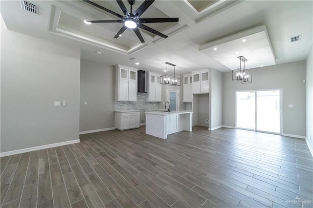 kitchen with a chandelier, open floor plan, backsplash, recessed lighting, and ceiling fan