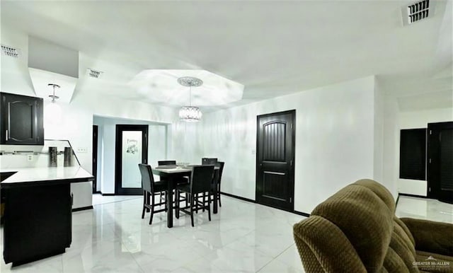 dining space with a chandelier