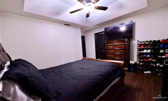 bedroom featuring ceiling fan and dark wood-type flooring