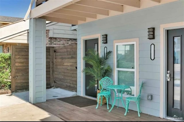 entrance to property featuring a wooden deck