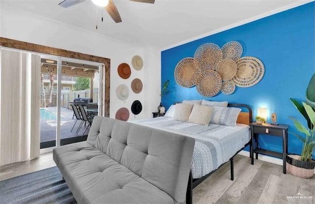 bedroom with access to outside, ceiling fan, and light wood-type flooring