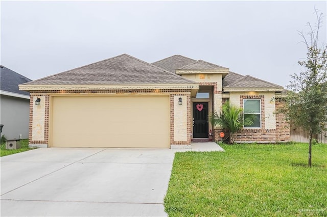 view of front of home with a garage and a front yard