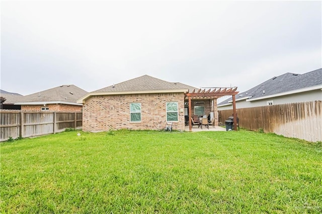 back of house with a lawn, a patio area, and a pergola