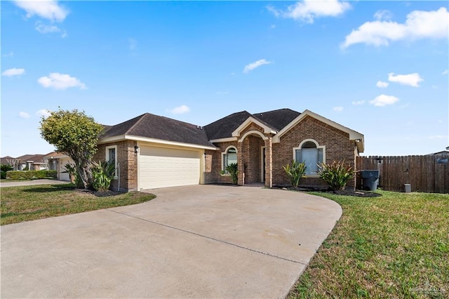 single story home with a garage and a front yard