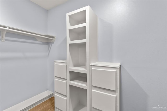 walk in closet featuring hardwood / wood-style floors