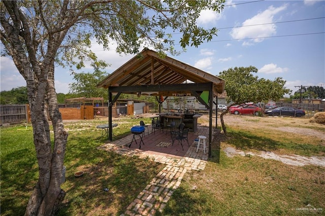 view of yard featuring a gazebo and a patio area