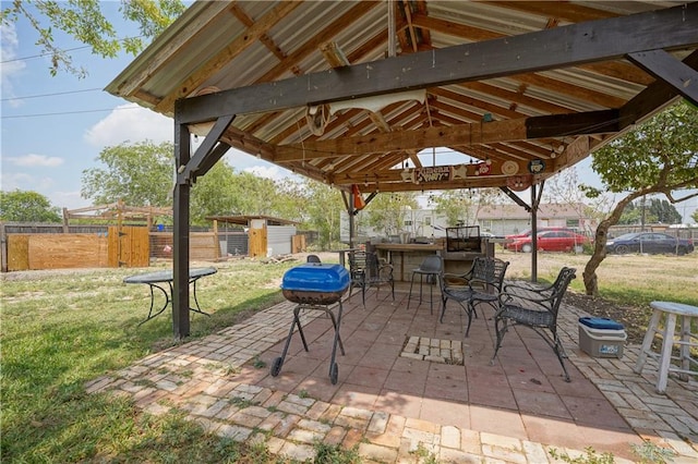 view of patio with a gazebo and a bar