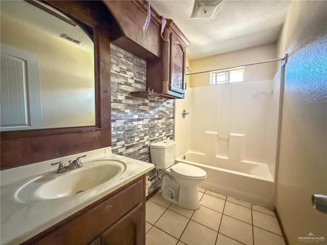 full bathroom featuring vanity, a textured ceiling, tile patterned floors, shower / bathtub combination, and toilet