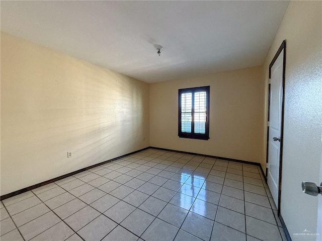 spare room featuring light tile patterned floors