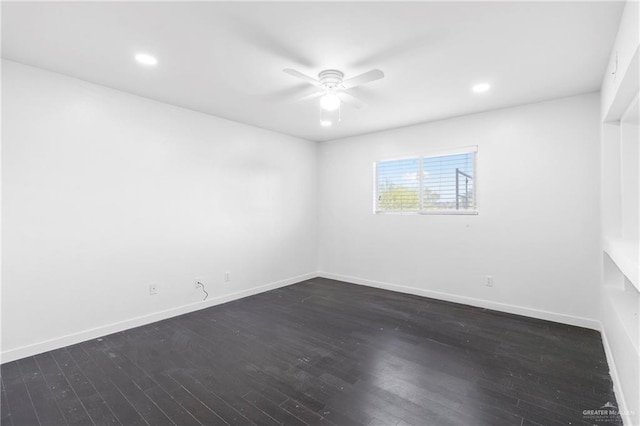 unfurnished room featuring ceiling fan and dark hardwood / wood-style flooring